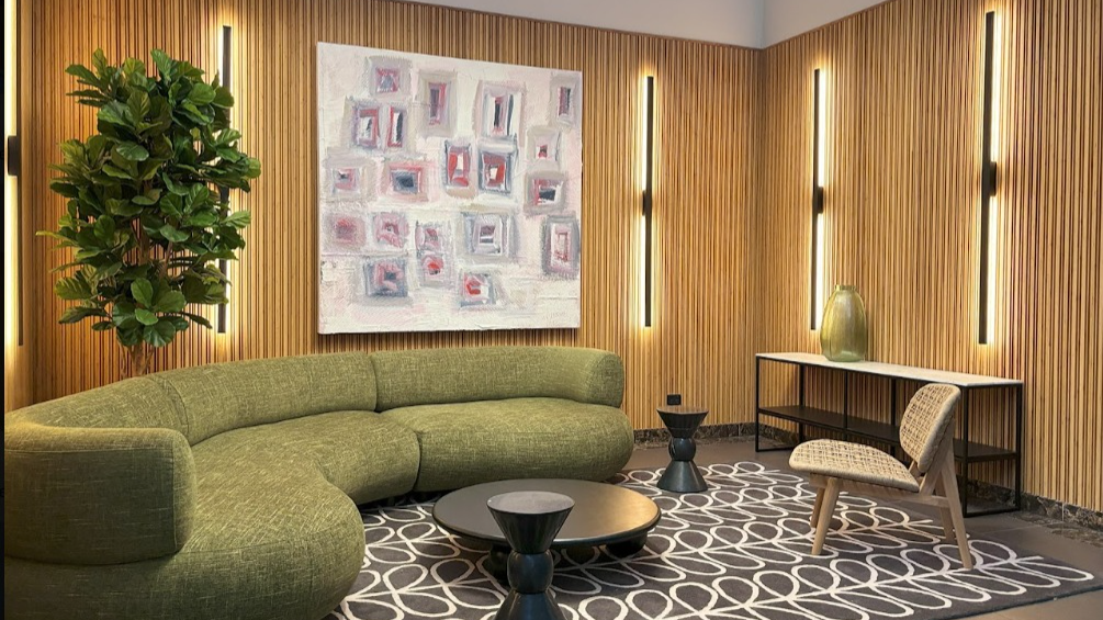 House of Bamboo interior with timber wall lining and green curved seating